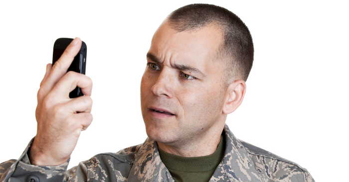 Veteran in uniform with phone